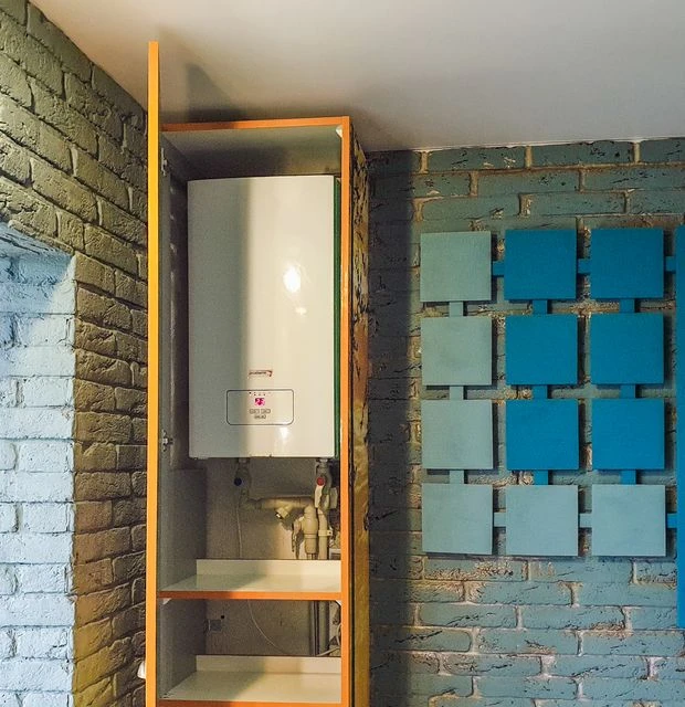 Indoor view of a water heater neatly installed in a cabinet with modern decor